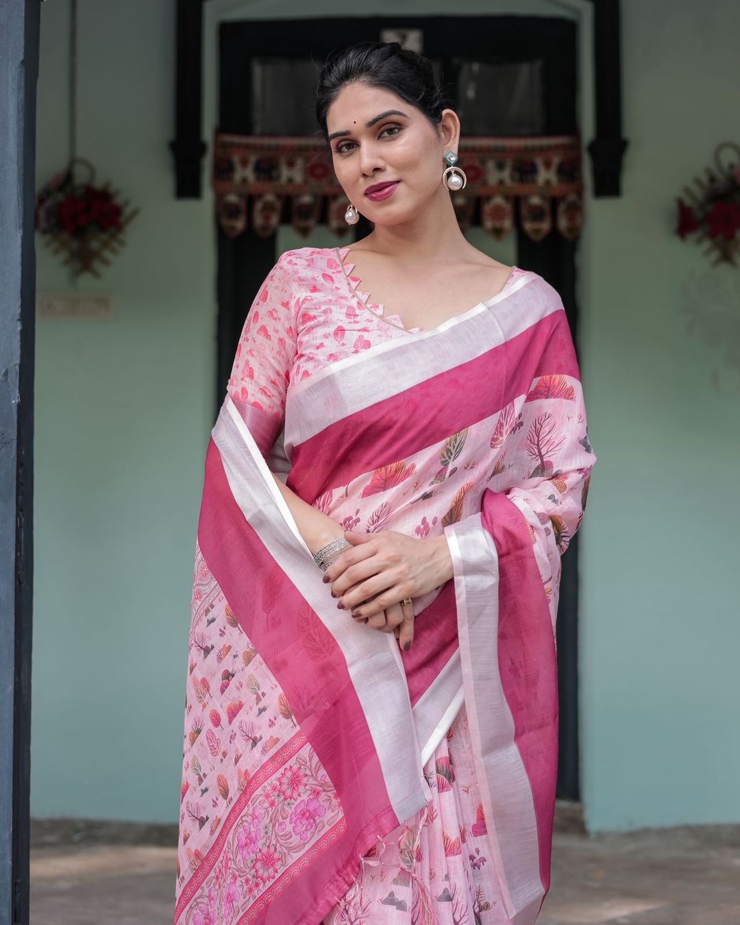 Soft Pink Floral Linen Saree with Elegant Border