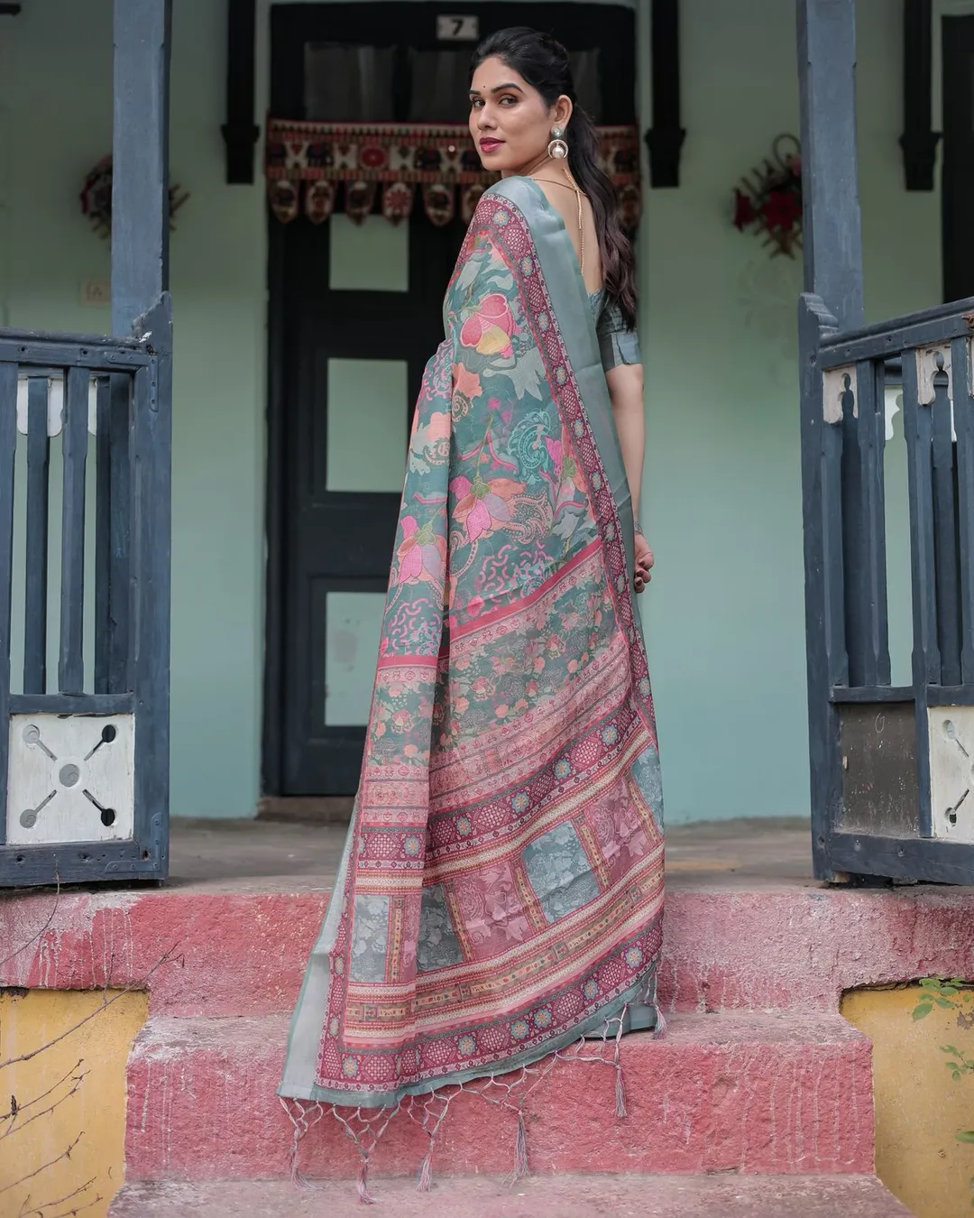 Teal Green Printed Linen Saree with Ethnic Border