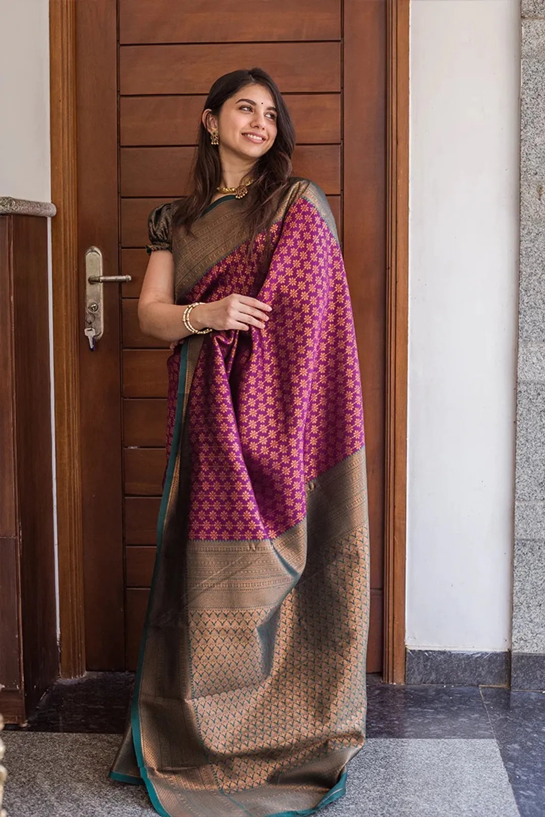 Traditional Purple Saree with Rich Green Border Design
