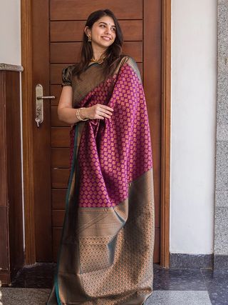 Traditional Purple Saree with Rich Green Border Design