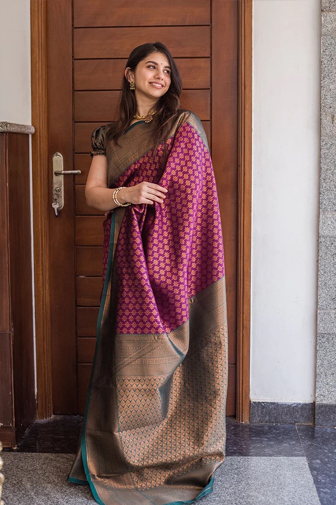 Traditional Purple Saree with Rich Green Border Design