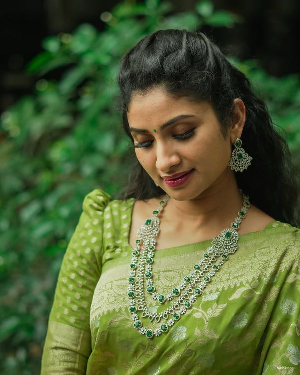 Festive Green Banarasi Saree with Subtle Zari Motifs