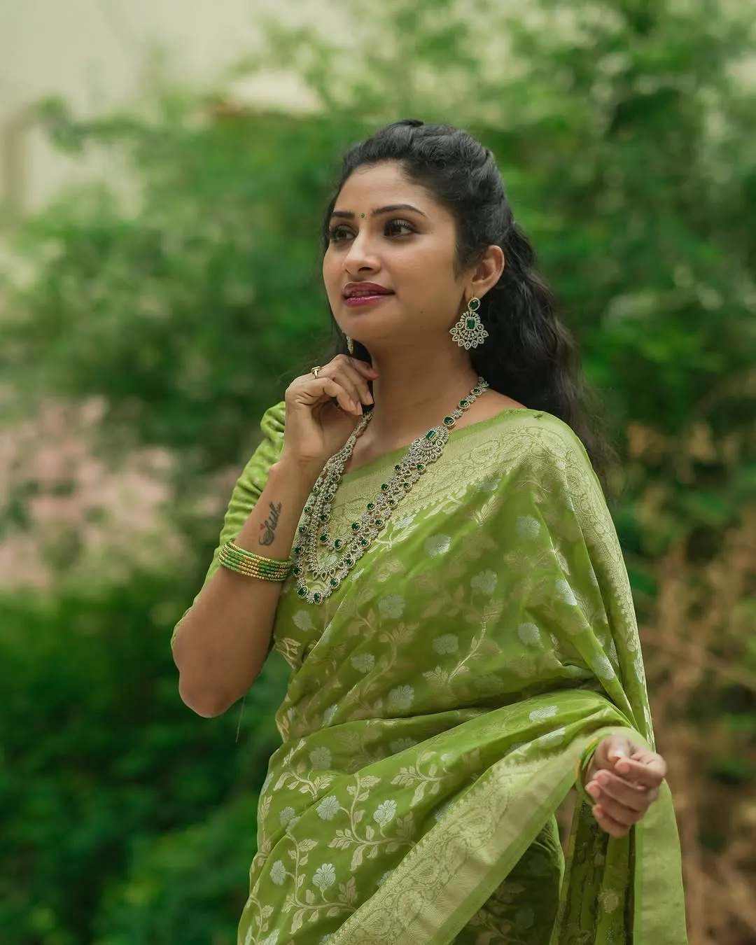 Festive Green Banarasi Saree with Subtle Zari Motifs
