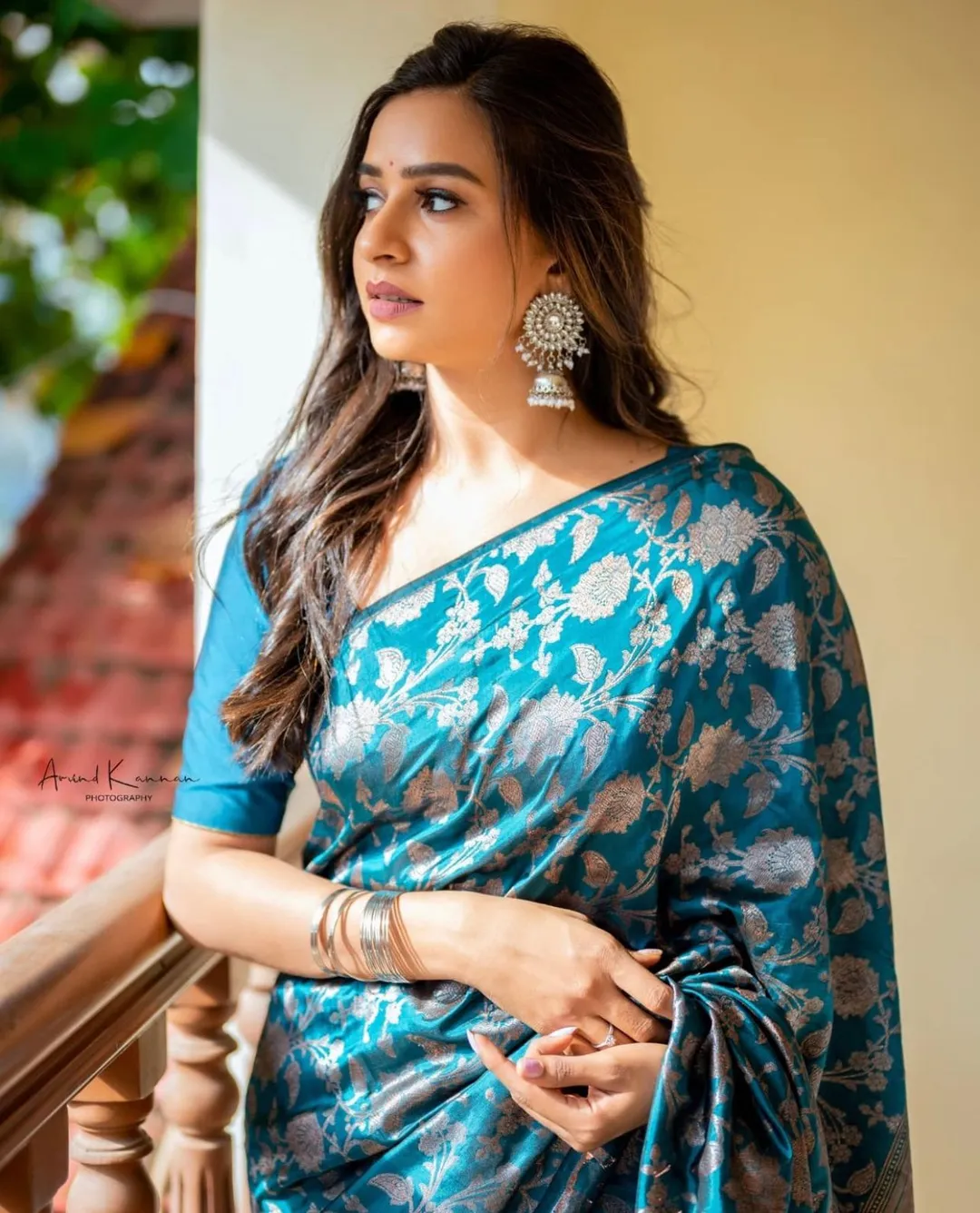 Elegant Teal Silk Saree with Floral Zari Design
