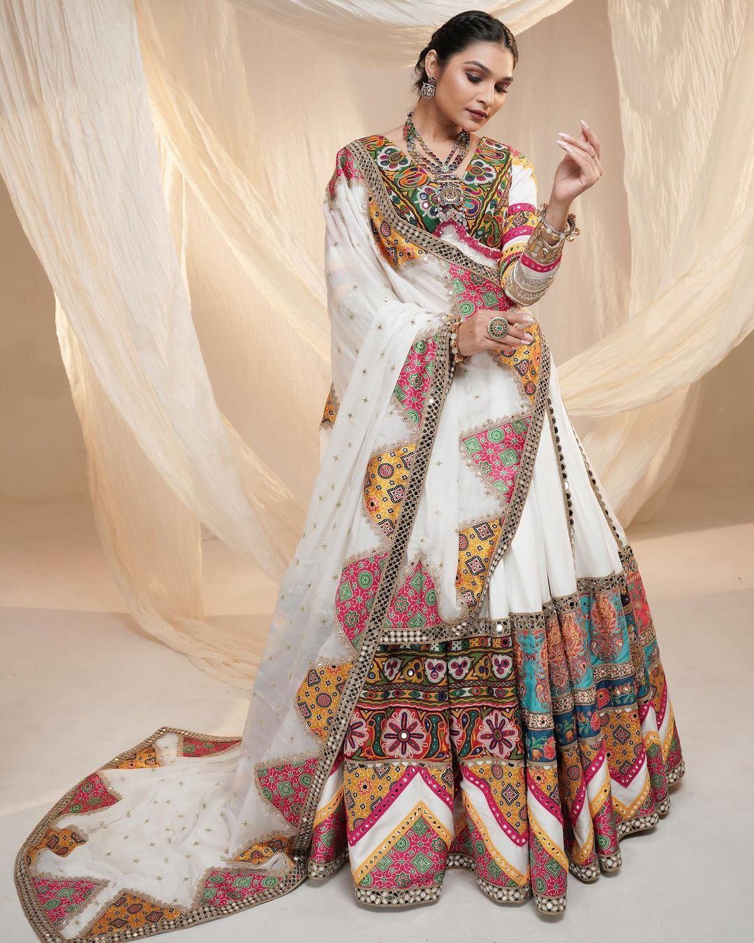 White lehenga with mirror work for festive