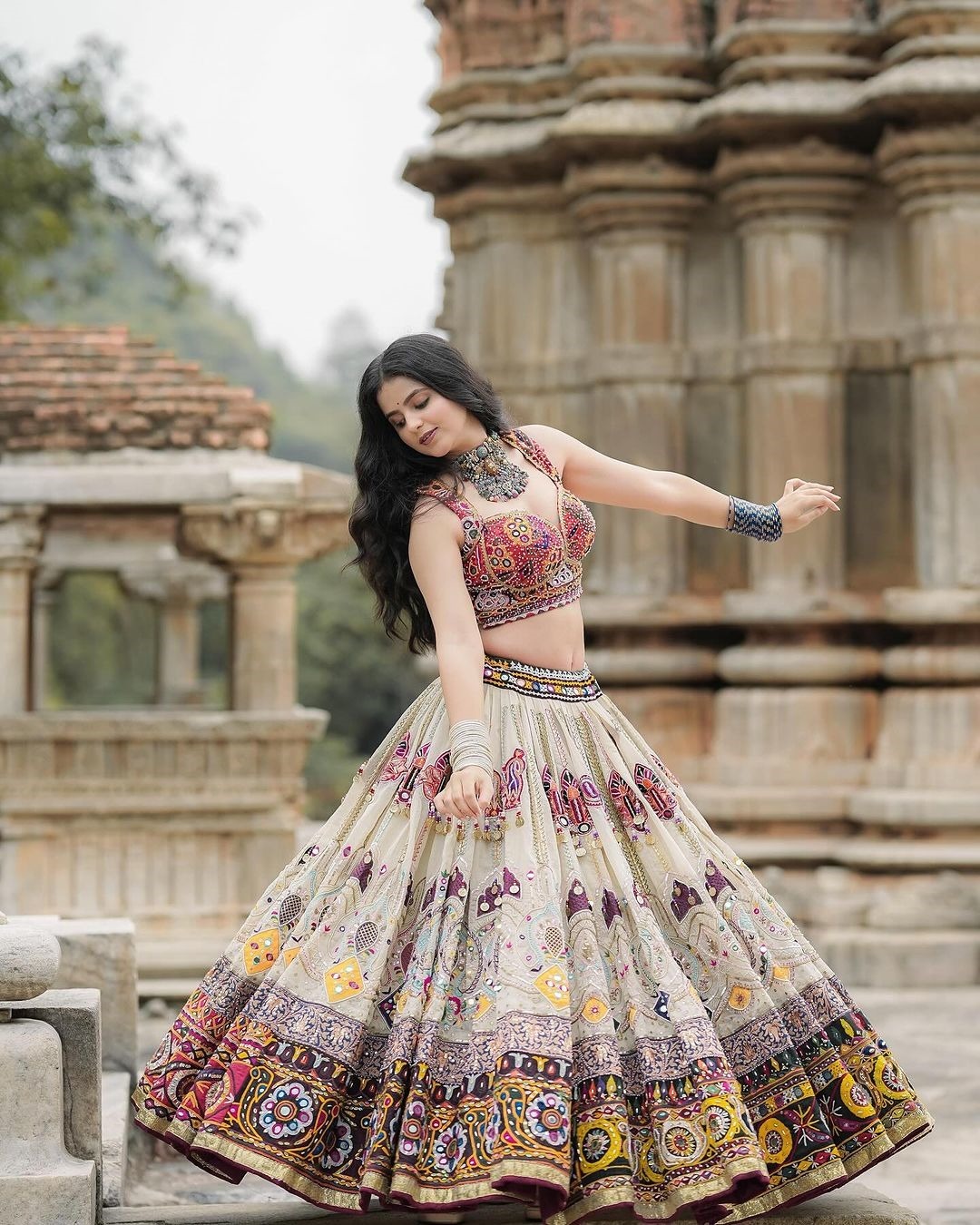 Cream lehenga with mirror work for wedding
