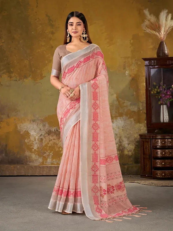 VARNAVI Peach Linen Cotton Floral Saree with Border Tassels