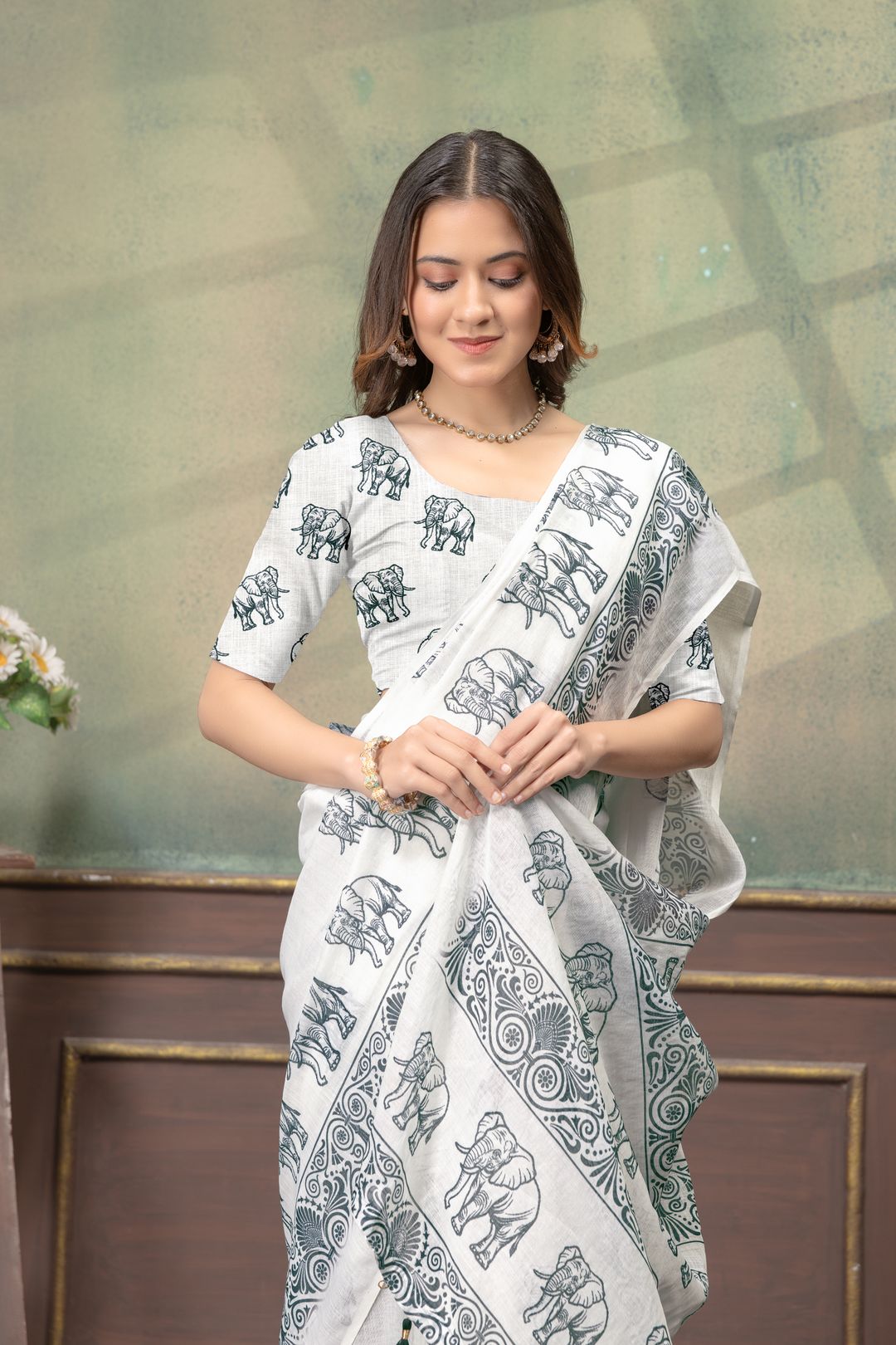 Ivory Linen Cotton Saree with Elephant Print Border Now