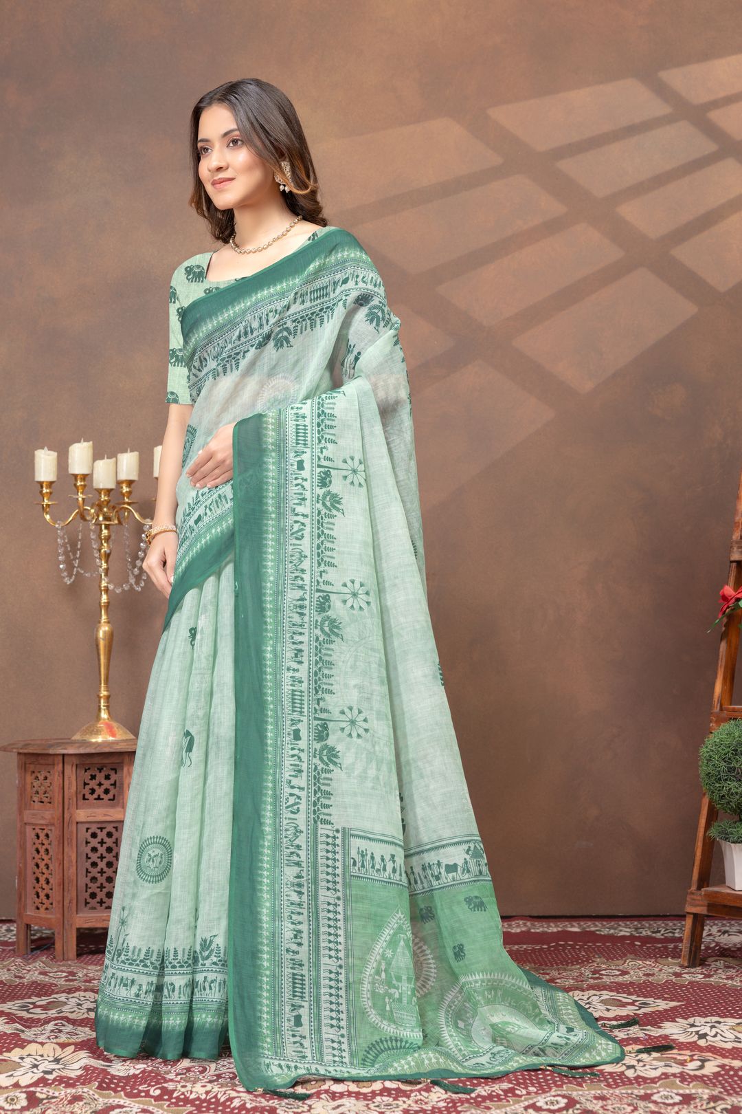 Pastel Green Folk Print Saree with Traditional Woven Border