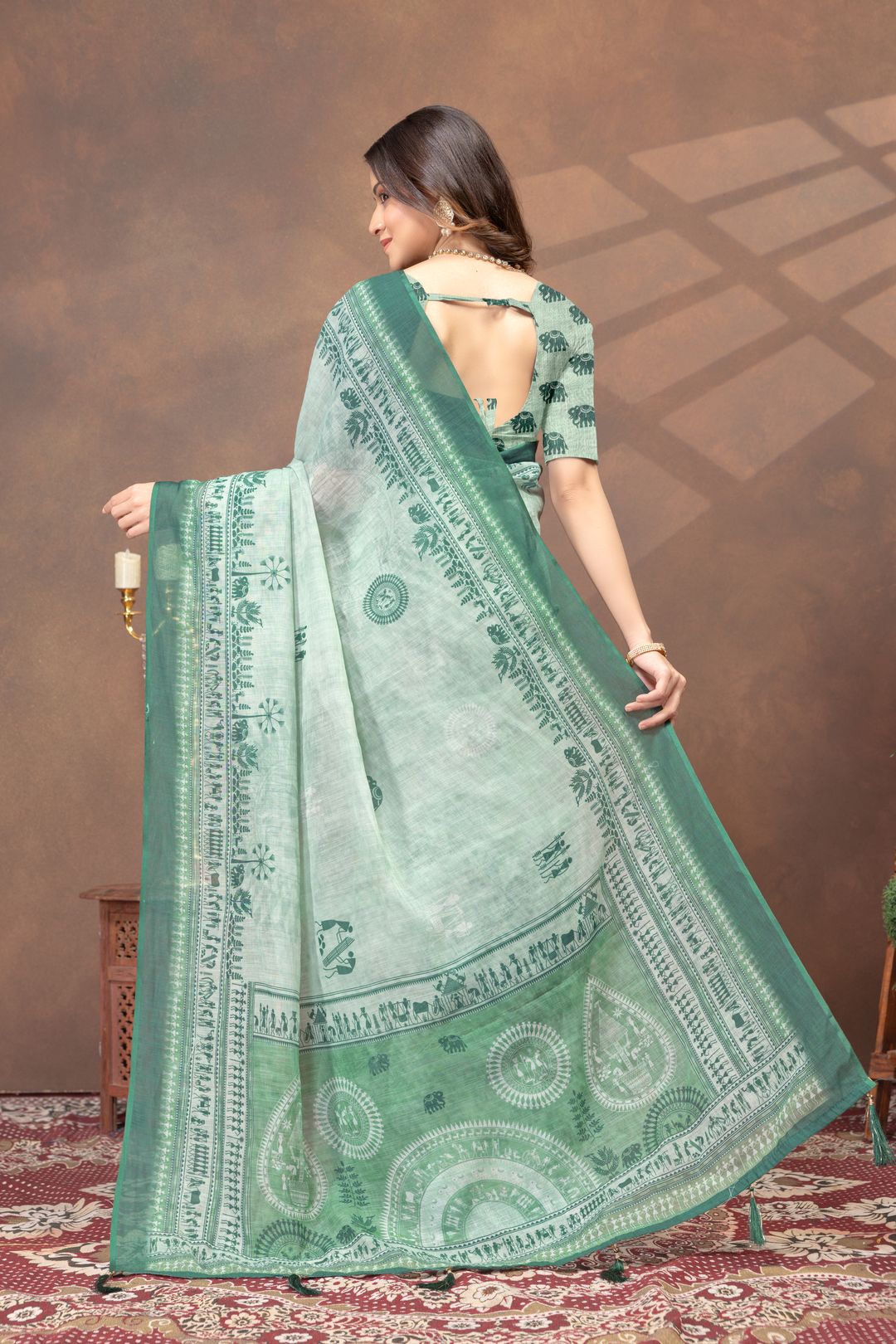 Pastel Green Folk Print Saree with Traditional Woven Border
