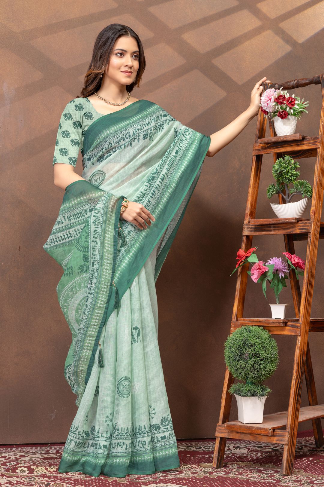 Pastel Green Folk Print Saree with Traditional Woven Border