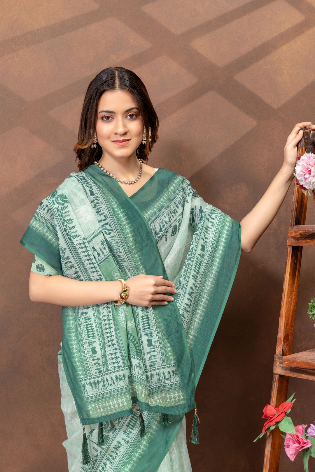Pastel Green Folk Print Saree with Traditional Woven Border