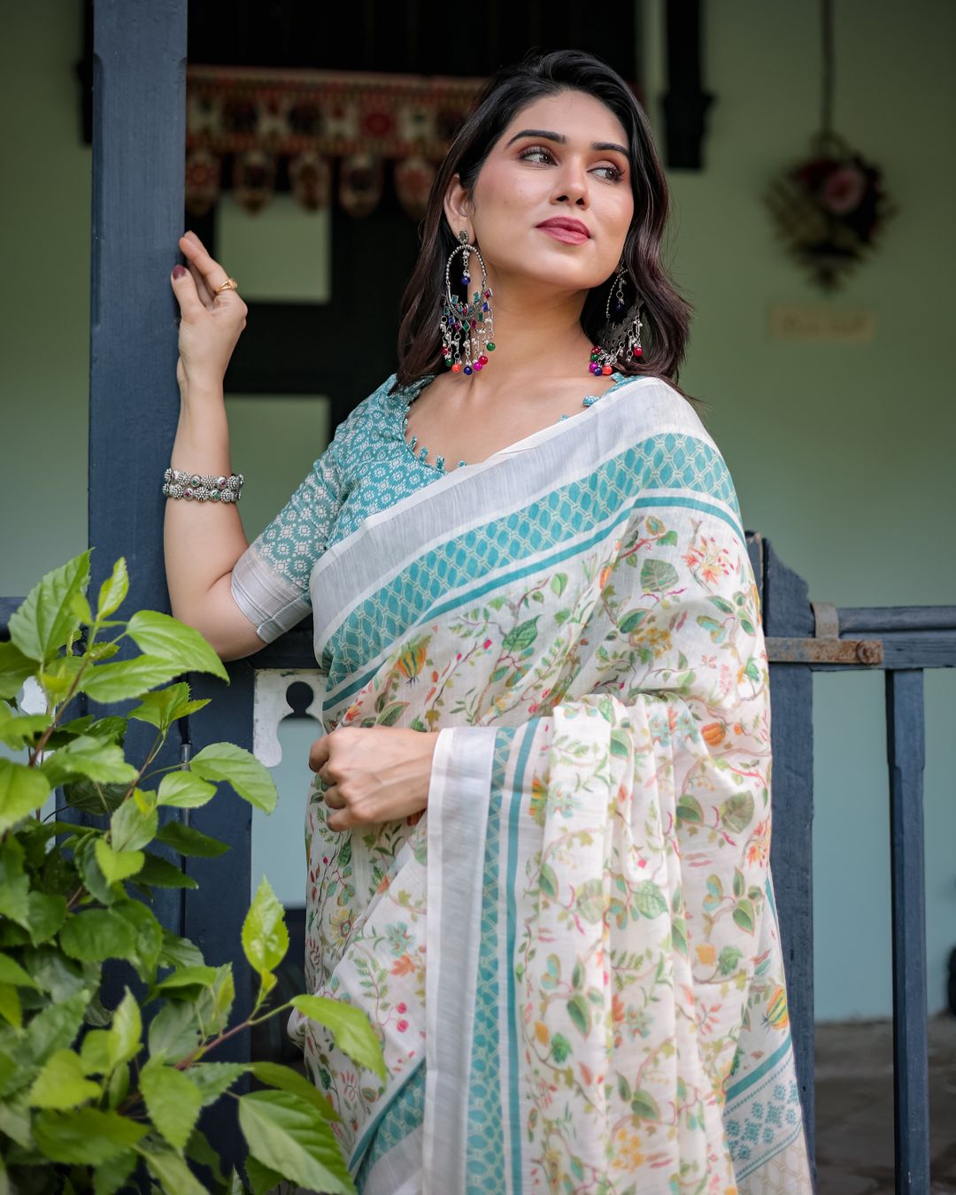 Ivory Floral Linen Cotton Saree With Teal Border Design