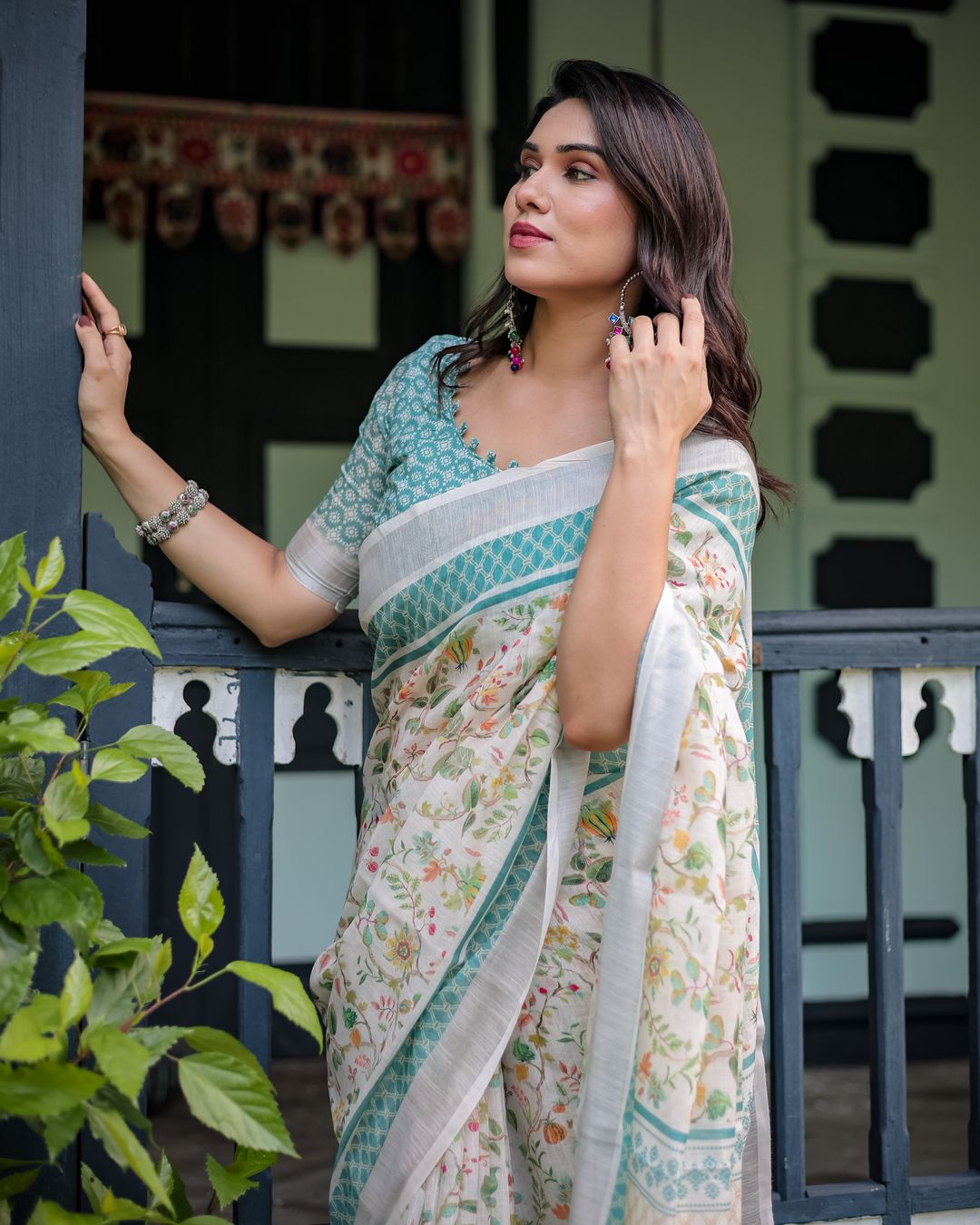 Ivory Floral Linen Cotton Saree With Teal Border Design