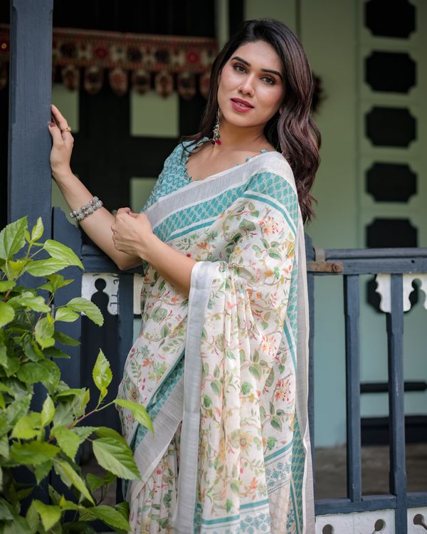 Ivory Floral Linen Cotton Saree With Teal Border Design