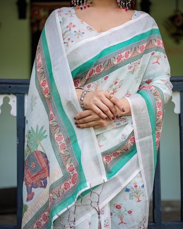 Ivory Floral Linen Cotton Saree With Teal Border Design