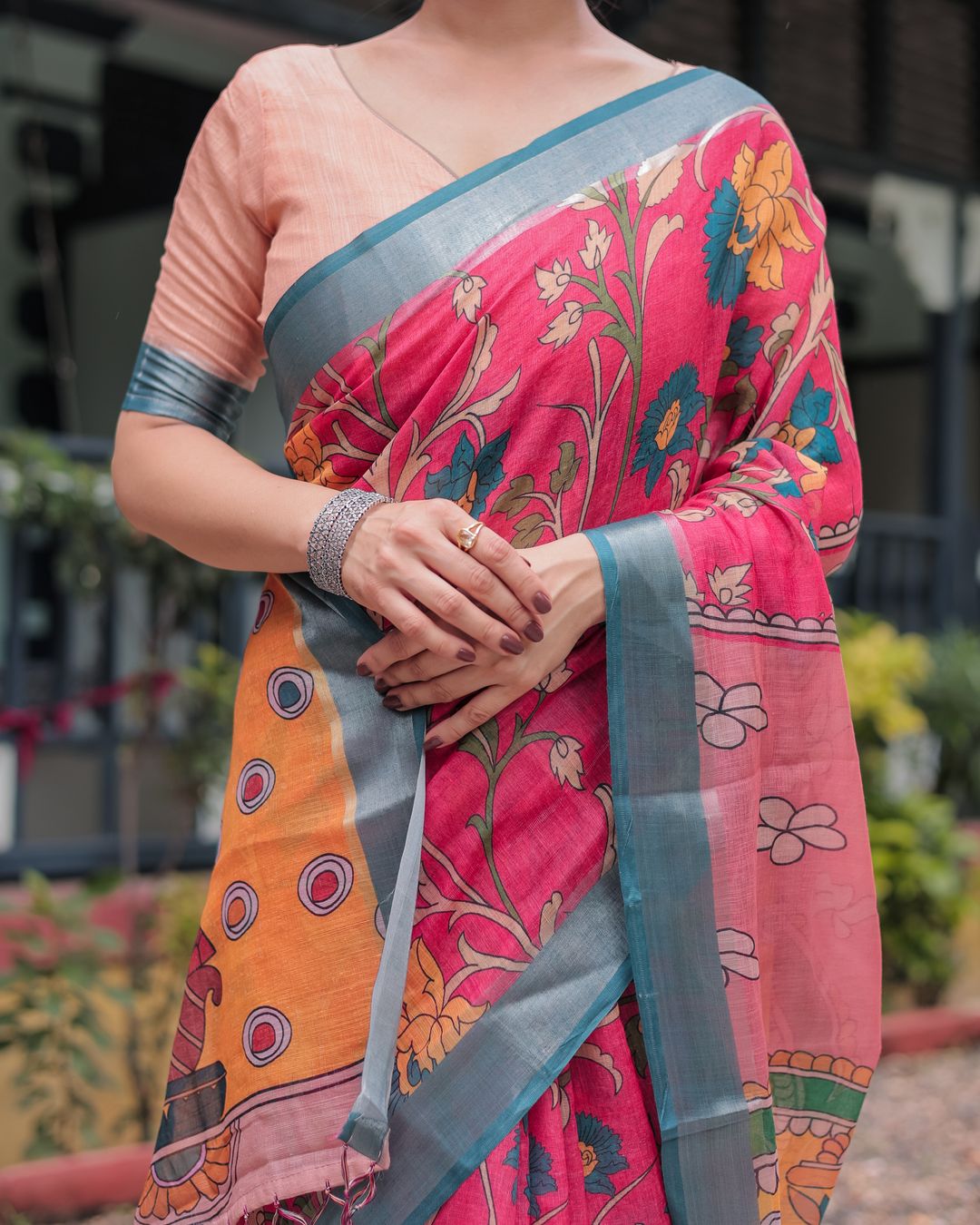 Coral Pink Linen Cotton Saree with Teal Edge & Tassel Pallu