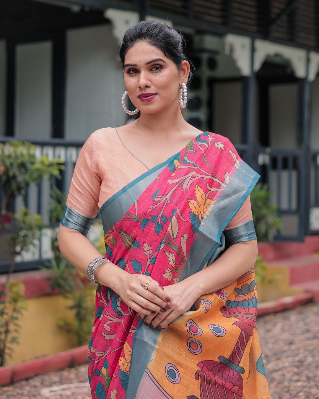 Coral Pink Linen Cotton Saree with Teal Edge & Tassel Pallu