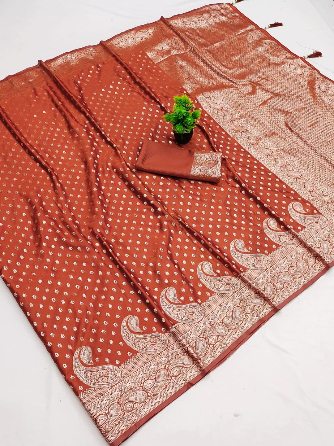Varnavi Rust Orange Satin Silk Saree with Golden Zari Paisley Border