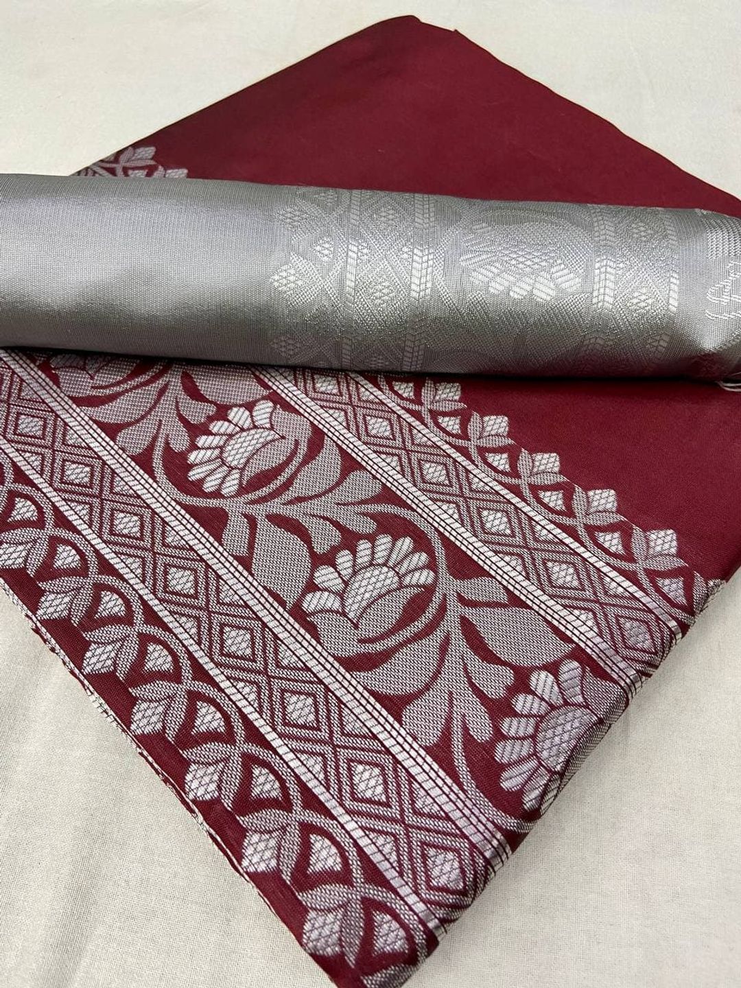 Varnavi Maroon Banarasi Soft Silk Saree with Silver Floral Border
