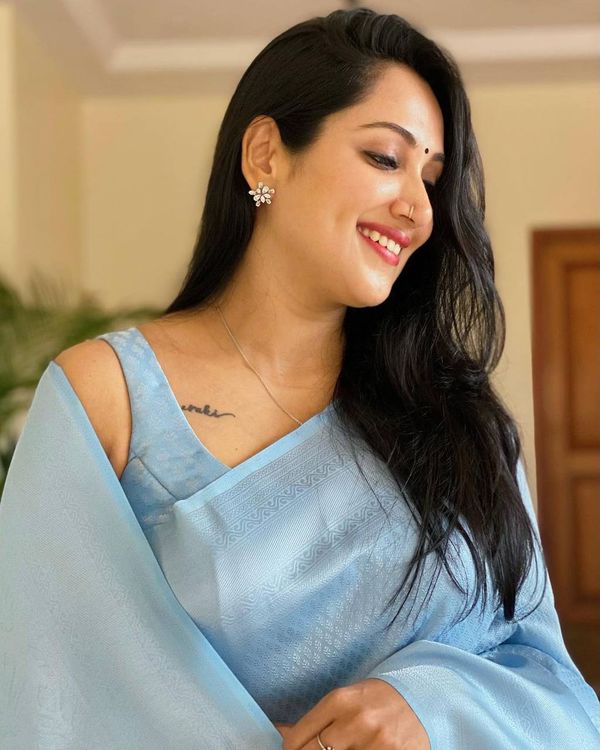 Sky Blue Soft Silk Saree with Elegant Plain Drape and Tassel Border
