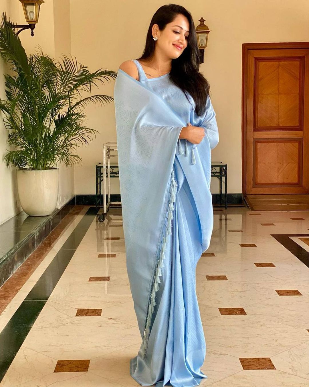 Sky Blue Soft Silk Saree with Elegant Plain Drape and Tassel Border