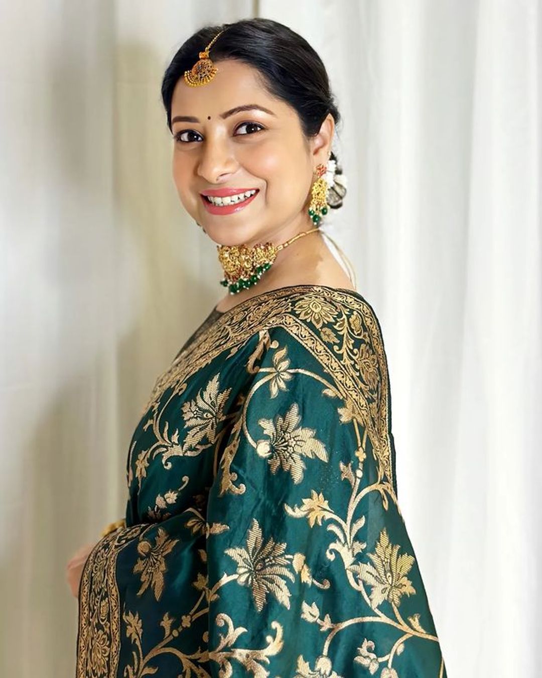 Varnavi Dark Green Banarasi Soft Silk Saree with Golden Floral Zari