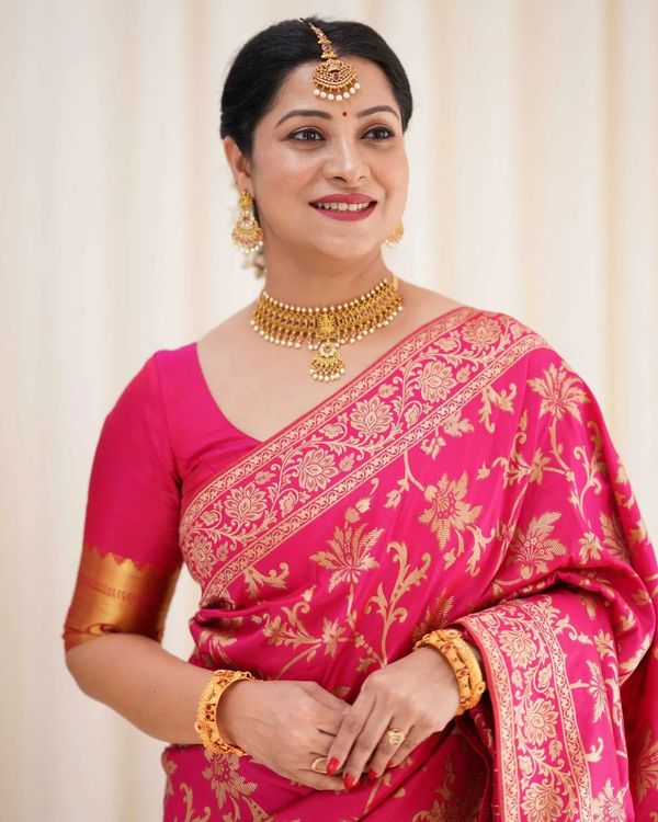 Varnavi Rani Pink Banarasi Soft Silk Saree with Golden Floral Weaving