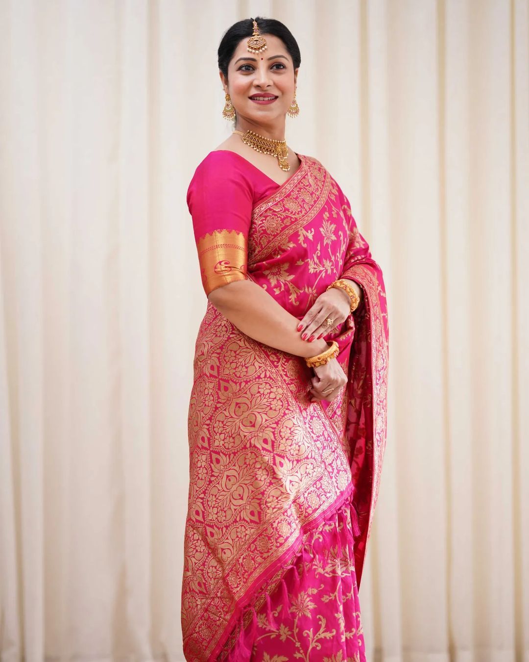 Varnavi Rani Pink Banarasi Soft Silk Saree with Golden Floral Weaving
