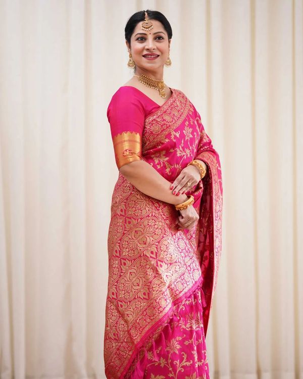 Varnavi Rani Pink Banarasi Soft Silk Saree with Golden Floral Weaving