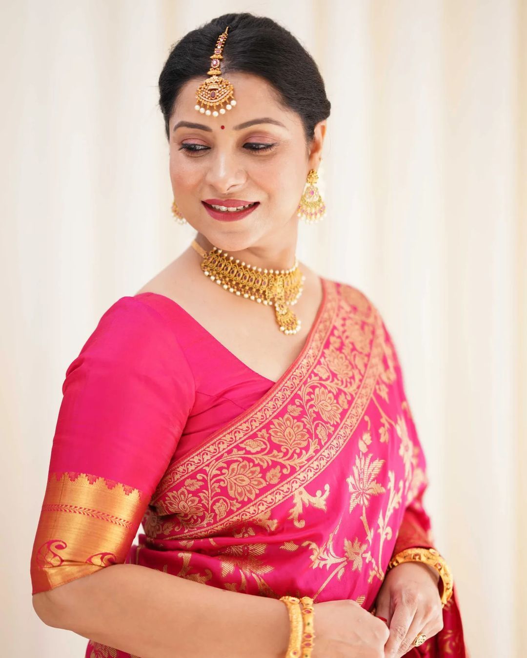 Varnavi Rani Pink Banarasi Soft Silk Saree with Golden Floral Weaving