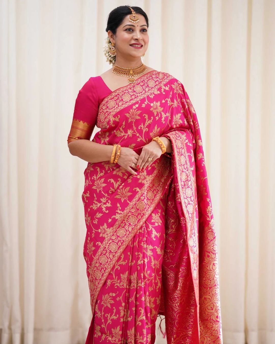Varnavi Rani Pink Banarasi Soft Silk Saree with Golden Floral Weaving
